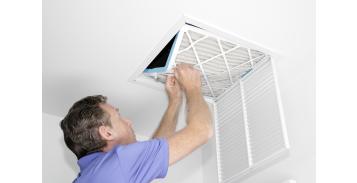 image of a person changing air filters